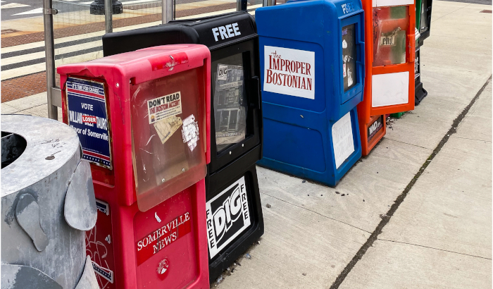 DigBoston box among the boxes of defunct newspapers in Union Square, Somerville. Photo by Jason Pramas. Copyright 2022 Jason Pramas.