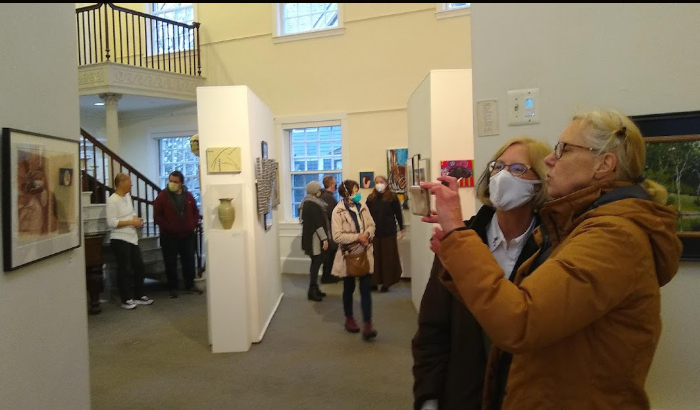 Admirers get a preview of this year’s First Look exhibit at the Somerville Museum. Photo by Ron Newman.