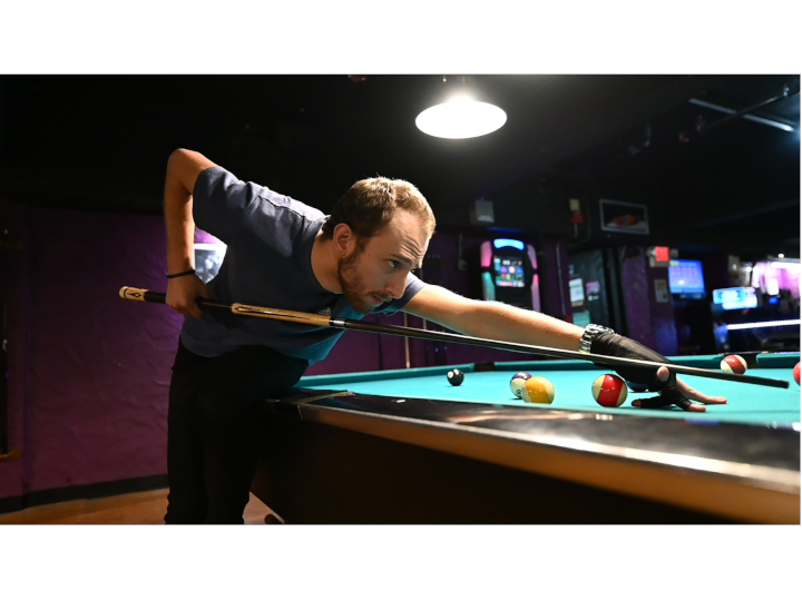 Ex-pool shark Aidan Lees, 25, in the final round of the Monday night tournament at Pockets Billiards Club in East Boston. Photo by Bryan Liu. Copyright 2023 Bryan Liu.