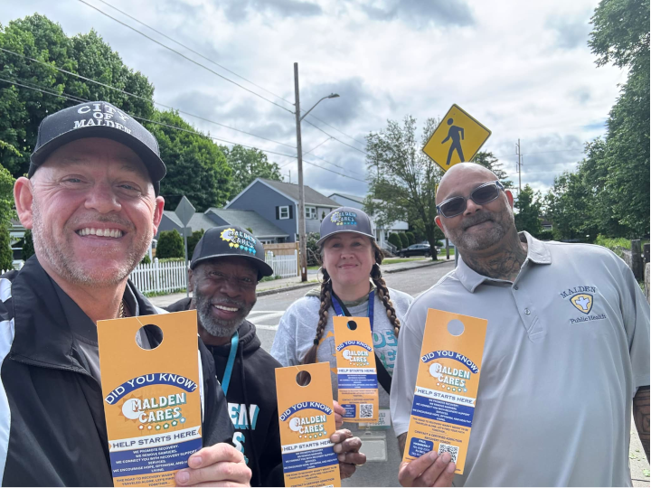 (Left to Right): Paul Hammersley, founder of Malden Cares, recovery coaches Kenny Gumes, Sandra Wood and PJ Bell. The Malden Cares recovery coaches go around Malden, knocking on doors to provide residents with addiction recovery resources. Photo courtesy of Malden Cares/Paul Hammersley.